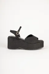 Sandalias negras de yute con hebilla ajustable y plataforma alta de 8cm.