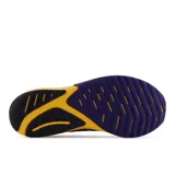 Championes de running New Balance FuelCell Propel v3, con empeine de malla transpirable en color azul y entresuela con tecnología FuelCell en degradado de amarillo a naranja. Presenta el logo N perfilado en el lateral y detalle de TPU en el talón.