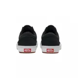 Championes Vans modelo BMX Old Skool, color negro con la icónica banda lateral en gris oscuro. Presentan una construcción resistente con suela blanca vulcanizada y base de goma color marrón.