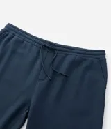 Pantalón de corte recto confeccionado en tejido de algodón y poliéster, con cintura elástica ajustable mediante lazo y bolsillos laterales.