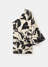 Vestido corto de viscosa con diseño asimétrico de un solo hombro y manga larga abullonada. Presenta un estampado botánico en tonos beige y negro.