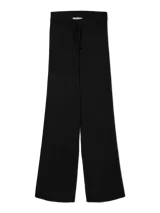 Pantalón tejido de punto con tiro medio y corte holgado. Presenta cintura elastizada con cordón ajustable y textura acanalada fina, ofreciendo una caída fluida y cómoda.