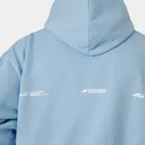 Hoodie oversized de color celeste, con capucha, bolsillo tipo canguro y estampado frontal en color blanco de la marca Eme Studios.