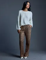 Pantalón largo de lentejuelas negras, marca Ninety, con pretina ancha elastizada, bolsillos laterales y forro a tono.