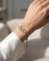 Pulsera de plata con dije de la palabra "hope" incrustado con circonias y cadena ajustable con cierre deslizante.
