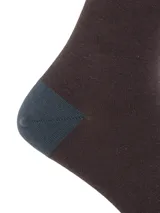 Medias largas de fibra de bambú, con diseño de bloques de color en tonos azul y marrón. Presentan el logo de la marca RKF bordado en la parte superior y en la puntera.