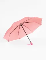 Paraguas automático color rosa con estampado de flores.