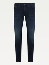 Jeans slim de Tommy Hilfiger confeccionados en denim elástico de mezcla de algodón, con diseño clásico de cinco bolsillos y lavado oscuro.