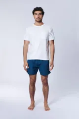Short de baño azul petróleo con estampado ripstop.