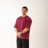 Remera negra de algodón, corte oversize, con inscripción 'GAINS.' en el frente.
