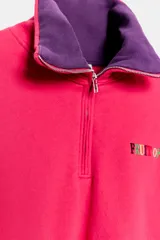 Sudadera de cuello alto con cierre de cremallera frontal y tejido interior en contraste. Cuenta con mangas largas, bolsillos de vivo en los laterales y detalle de logo bordado en el pecho. Diseño de la colección especial Fruit of the Loom x Zara.