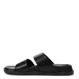Sandalias de mujer Miss Carol modelo Vinka, de tipo slide con dos tiras anchas en color negro con textura de efecto reptil.