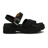 Sandalias de mujer Vizzano con tiras cruzadas blancas en el empeine, tira ajustable con hebilla metálica en el talón, y suela flatform negra con plataforma track.