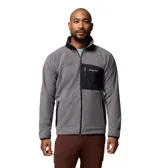 Campera de polar Columbia con cierre frontal completo, cuello alto y bolsillo en el pecho con cierre y panel de contraste. Presenta ribetes elásticos en puños y dobladillo.
