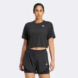 Remera deportiva Adidas de entrenamiento, color negro, de corte holgado y diseño cropped. Presenta cuello redondo, mangas cortas con hombros caídos y el logo de la marca estampado en blanco en el pecho.