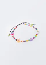 Tobillera de hilo negro con mostacillas de colores y dijes de flores de colores. Ajustable.