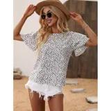 Blusa de manga corta con estampado de puntos negros sobre fondo blanco. Presenta un diseño de corte suelto con mangas que incluyen volados superpuestos y cuello redondo.