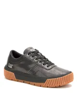 Championes Cat modelo Amp para mujer, de color negro con textura punteada, cordones negros y suela de goma marrón con plataforma acanalada.