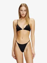 Colaless negra de nylon elástico suave, de silueta minimalista, con placa metálica Oval D en la parte posterior.