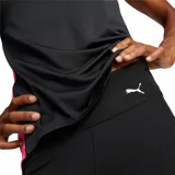 Calza larga de lycra negra con cintura alta y logo de Puma estampado en blanco en la pierna derecha.