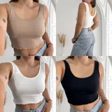 Musculosa ajustada de tejido acanalado (morley), con escote redondo y bordes ondulados en el ruedo. Disponible en colores beige, blanco y negro.