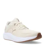 Championes de running Puma Skyrocket Lite 2, color beige con detalles en tono bronce. Presentan una estructura de malla transpirable, entresuela blanca de amortiguación reactiva y suela de goma en color marrón.