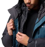 Campera 3 en 1 Columbia con sistema Interchange, compuesta por una capa exterior impermeable y transpirable con tecnología Omni-Tech y una capa interior aislante con forro termorreflectante Omni-Heat. Presenta diseño bicolor en azul y gris oscuro, capucha ajustable, ventilación en axilas, faldón para nieve y múltiples bolsillos con cierre.
