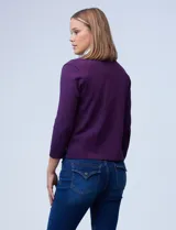 Bolero tejido color verde oscuro, marca Nina Leonard, con mangas 3/4 y corte clásico.