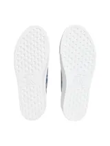 Zapatillas de plataforma Calvin Klein con diseño de sarga jacquard e ඉmpronta monograma integral en tonos azul y gris. Cuentan con suela gruesa de goma blanca, cordones azules y etiqueta lateral distintiva de la marca.