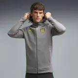 Campera deportiva con capucha Puma del Club Atlético Peñarol, color gris con detalles en amarillo. Cuenta con cierre frontal completo, bolsillos laterales y el escudo del club junto al logo de la marca en el pecho.
