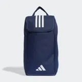 Bolso para calzado Adidas de la línea Tiro League, color azul marino. Diseñado para transportar botines de fútbol, cuenta con un panel lateral de malla para ventilación, asa de mano superior y cierre de solapa. Presenta las tres tiras icónicas y el logo de la marca en color blanco.