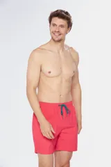 Short de baño liso color verde esmeralda, con cintura elástica y cordón ajustable.