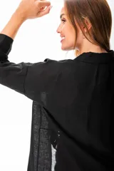 Camisola negra de algodón con corte relajado y terminaciones limpias.