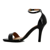 Sandalia de tacón alto Vizzano, color negro charol, con tira fina en la punta y pulsera ajustable con hebilla en el tobillo.