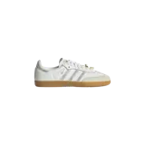 Championes Adidas Samba OG, modelo para mujer, color blanco con detalles plateados y suela de goma de tono tostado.