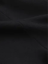 Pantalón negro de lana, corte recto y talle alto.