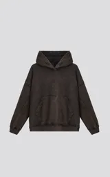 Hoodie de corte oversize y largo crop, confeccionado en algodón con efecto de desgaste y color óxido. Presenta costuras expuestas, detalles de roturas en los bordes y bolsillo frontal tipo canguro.