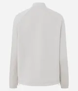 Campera deportiva de cuello alto con cierre frontal, mangas largas con puños elásticos y diseño de corte raglán. Presenta un estilo minimalista y funcional con cintura ajustable.