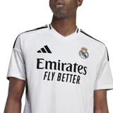 Camiseta de fútbol Adidas del Real Madrid, color blanco con detalles en negro.