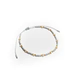 Pulsera elástica con cuentas de vidrio color gris, perlas cultivadas y detalles dorados.