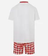 Pijama masculino de algodón, compuesto por una remera blanca de manga corta con cuello redondo y ribete rojo, y un short con estampado a cuadros rojos y blancos con figuras de Snoopy y Woodstock.