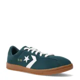 Championes Converse All Star Classic Trainer confeccionados en gamuza color verde petróleo, con el icónico logo de estrella y chevron en blanco en el lateral, cordones blancos y suela de goma color caramelo.