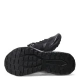 Championes de running New Balance modelo Nitrel, color negro, con diseño de malla transpirable y refuerzos sintéticos en la puntera y laterales. Presenta el logo N característico en el lateral y suela con tecnología AT Tread para mayor tracción.