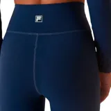 Calza de entrenamiento Fila Touch Gym, color azul marino, con diseño de cintura cruzada en V y ajuste al cuerpo.
