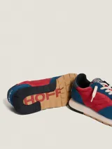 Championes Hoff modelo Fliunte, color azul y rojo, con detalles en blanco y suela marrón.