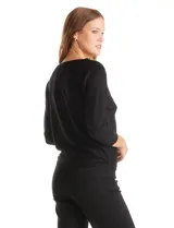 Buzo negro de tejido con strass, marca LIV Milano. Cuello redondo, manga japonesa y largo ¾.