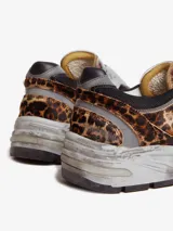 Zapatillas deportivas Golden Goose modelo Dad-Star, con estampado de leopardo, detalles en malla negra y estrella blanca en el lateral.