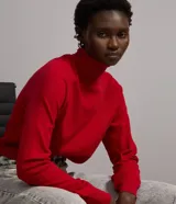 Blusa de punto de la marca Blue Steel, con cuello alto, manga larga y diseño básico ajustado al cuerpo.