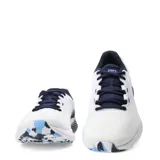 Championes de running Under Armour Charged Rogue 4, color blanco con detalles en azul marino y celeste, con diseño de malla transpirable y suela con amortiguación Charged Cushioning.