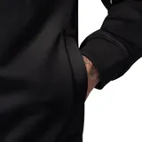 Campera deportiva Nike Jordan color negro, con cierre frontal completo, cuello tipo bomber y detalles de líneas blancas en los hombros. Presenta el logo Jumpman bordado en el pecho.